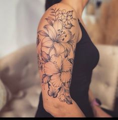 a woman with a flower tattoo on her arm