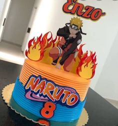 a birthday cake is decorated with an image of naruto and the number 8