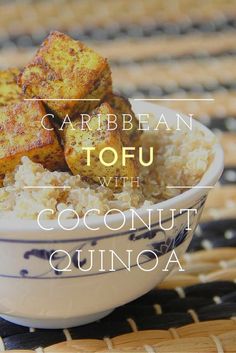 a bowl filled with coconut quinoa and tofu on top of a table