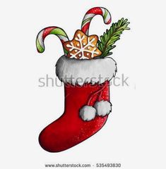 a christmas stocking with candy canes and gingerbread on it, painted in watercolor