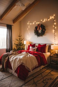 a bedroom decorated for christmas with lights on the ceiling and a wreath above the bed