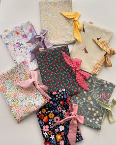 several different types of cloths with bows on them