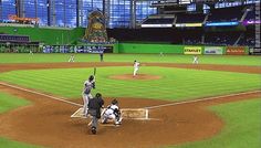 a baseball game in progress with the batter up to plate