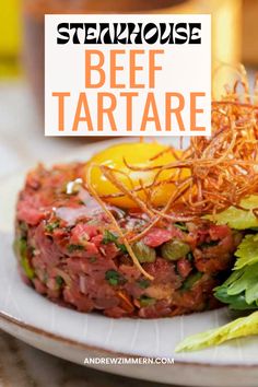 steak tartare on a plate with lettuce and tomato