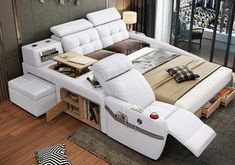 a bed that has been made into a couch with lots of pillows on top of it