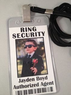 an id card with a lanyard attached to it that has a photo of a young boy wearing sunglasses