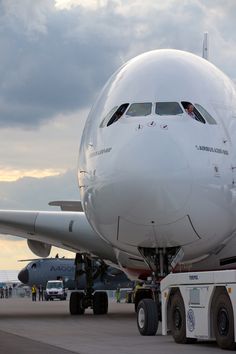 a large jetliner sitting on top of an airport tarmac