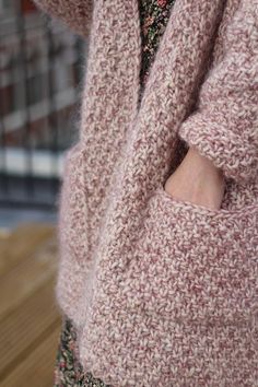 a close up of a person wearing a sweater