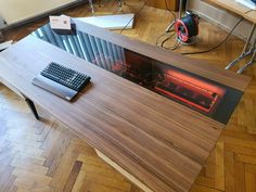 a computer desk with a keyboard and mouse on it