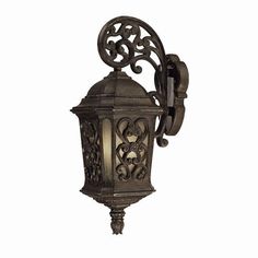 an old fashioned wall light with ornate designs on the front and back sides, against a white background