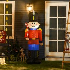 a large inflatable nutcracker standing next to a house