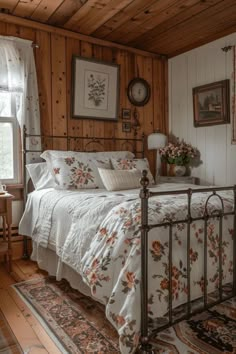 a bed sitting in a bedroom next to a window