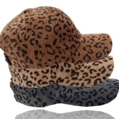 Dani & EmFuzzy Leopard Baseball Cap An adorable faux fur fuzzy leopard baseball cap.This super stylish cosy hat will keep you looking good and feeling warm. Comfortable and fashionable and perfect for casual wear, daily wear, outer wear, work wear, travel, and sport’s. Features a soft faux fur material which will keep your head warm and adds that special accent touch to any favorite top, sweater, jeans, winter coat, jacket, vest, scarf or more. An absolutely gorgeous addition to any wardrobe! One Size - Circumference: 56cm-60cm/22.0"-23.6"; Adjustable; Great fit for most teens and adults. Design : The leopard print baseball hat features an all over leopard print design Casual Faux Fur Beanie Hat, Casual Faux Fur Beanie, Trendy Fall Hats With Faux Fur Lining, Trendy Brown Baseball Cap For Winter, Trendy Brown Winter Baseball Cap, Trendy Winter Baseball Cap, Trendy Winter Flat Cap Baseball Cap, Trendy Winter Baseball Cap With Curved Brim, Casual Adjustable Hat With Faux Fur Lining