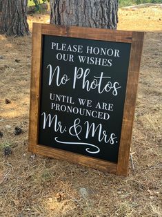 a sign that says please honor our wishes no photos until we are pronounced mr and mrs