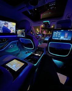 the interior of a car with multiple monitors and touchscreens on it's sides