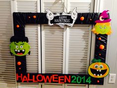 a door decorated for halloween with decorations on it