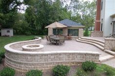 an outdoor patio with steps and seating area