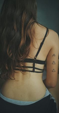 a woman with a tattoo on her back