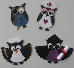 four paper cut outs with owls and graduation caps on them