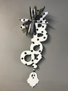 a clock that has been decorated with black and white decorations