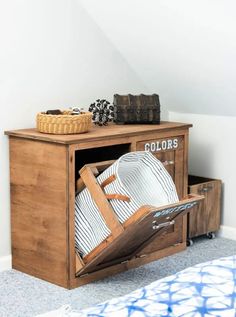 a wooden cabinet with plates in it and other items on the top shelf next to it