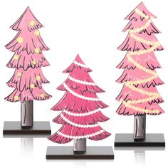 three pink christmas trees are standing on black bases