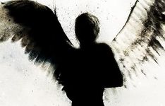 the silhouette of a person with an angel wings