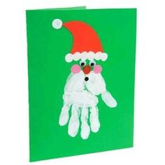 a handprinted christmas card with santa's hat and eyeballs on it