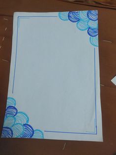 a piece of paper with blue and white designs on it