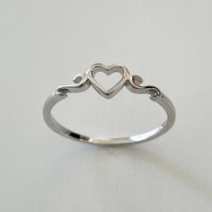 Sterling Silver Cute Tiny Heart Ring, Dainty, Silver, Statement, Love, I Love You, Thank You Ring. Can Be Wear On Multiple Fingers And Midi Ring Or Toe Ring. Symbolizes Love, Unity, Trust, And Friendship 925 Stamped Perfect Gift Idea For Birthday, Anniversaries, Engagement, Graduations, Bridesmaid, Mother’s Day, Valentine’s Day, Christmas, Promise, Good For Any Occasion. Note: Due To The Difference Between Different Phone Or Monitors, The Pictures May Not Reflect The Actual Color Of The Ring. We Hesrt Rings, Jewellery Rings Silver, Cute Little Rings, Cool Promise Rings, Cute Ring Designs, Cute Aesthetic Rings, Pretty Silver Rings, Silver Rings Jewelry, Silver Anniversary Ring