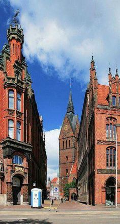 an old brick building with two towers on each side