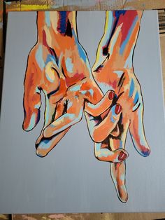 two hands holding each other painted on canvas