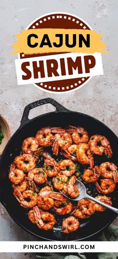 a skillet with shrimp in it and the words cajun shrimp written above it