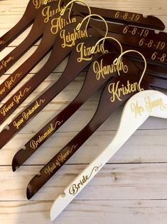 personalized wooden hangers with names and date on them for brides to wear