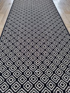 a black and white rug on the floor