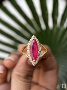 5.50 Carat Marquise Moissanite Ring Marquise Cut Engagement Ring Marquise Pink Ruby Victorian Split Shank Halo Unique Ring Anniversary Gift 𓆩⟡𓆪  -------------------------------------------  𓆩⟡𓆪 Product Description : » Main Stone Material : (CZ: Simulated Diamond, M: Moissanite Diamond) » Center stone: Marquise Cut. » Stone Size: 17*6.10 MM  » Center stone Carat: 5.50 CT         » Side Stone: Round  » Color: Colorless » Clarity: VVS1 » Total Carat Weight: 6.03 CT Approx.   (Size And Carat Weight May Variation Depending On Ring Size) Metal: S925 Sterling Silver, 10k Solid Gold, 14k Solid Gold, 18k Solid Gold,  ( Contact Us For Order In Platinum ) --------------𓆩⟡𓆪 ------------------------------------------- 𓆩⟡𓆪 ⚜️ Handmade Jewelry 👐 With 100% Authentic Material ⚜️ ABOUT THE RING : Ruby Rings With Halo Setting And Marquise Cut, Ruby Rings With Marquise Cut In Halo Setting, Marquise Ruby Promise Ring With Prong Setting, Wedding Ruby Ring With Vvs Clarity Marquise Cut, Dazzling Marquise Gemstone Rings, Moissanite Jewelry With Marquise Cut And Accent Stones, Marquise Ruby Ring With Center Stone For Promise, Diamond Cluster Ring With Gemstone In Open Design, Fine Jewelry Moissanite Ruby Ring