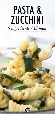 pasta and zucchini on a plate with a spoon