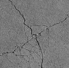 the cracks in the concrete are cracked