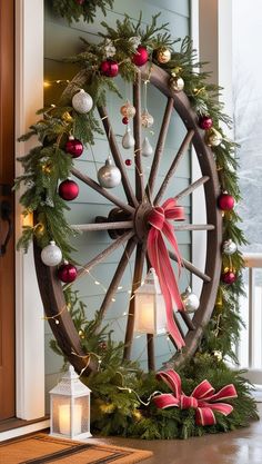 a wheel decorated with christmas decorations and lights on the front door to give it a festive feel