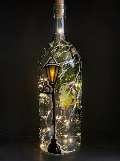 a lighted bottle with a street light inside