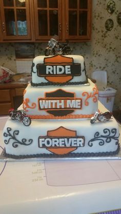 a three tiered cake that says ride with me and forever on the bottom layer