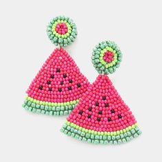 a pair of pink and green beaded watermelon earrings on a white background