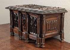 an old wooden table with ornate carvings on it