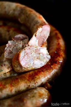 some sausages are sitting in a bowl on the table