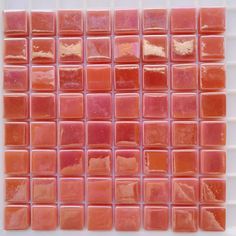 an orange and pink mosaic tile pattern on a white background