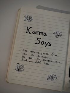 an open notebook with writing on it that says karma says god removes people from your life because he has the conversations that you didn't