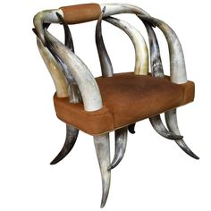 the chair is made out of horns and leather