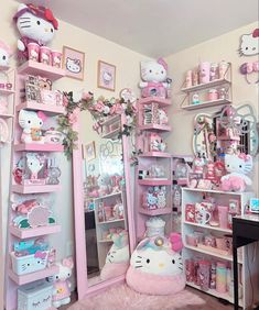 a room filled with hello kitty toys and other items in pinks, whites and pastels