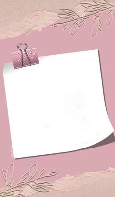 a piece of paper with a note attached to it on a pink background that has leaves and vines around it