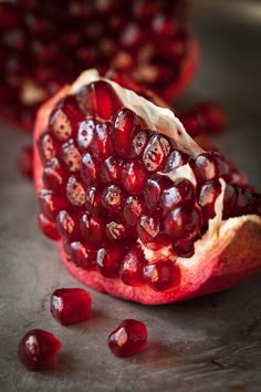 the pomegranate is cut in half and ready to be eaten